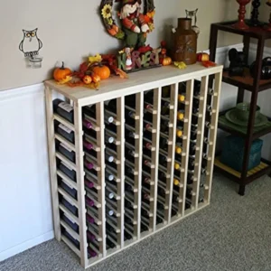 A wine rack with many bottles of wine on top.