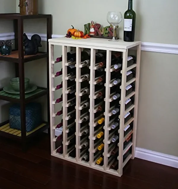 A wine rack with many bottles of wine on top.