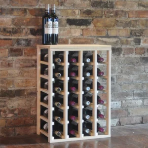 A wine rack with bottles of wine on top