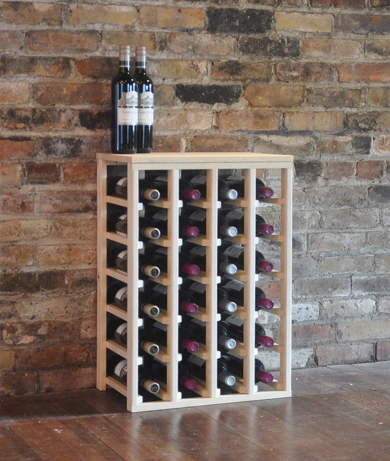 A wine rack with bottles of wine on top