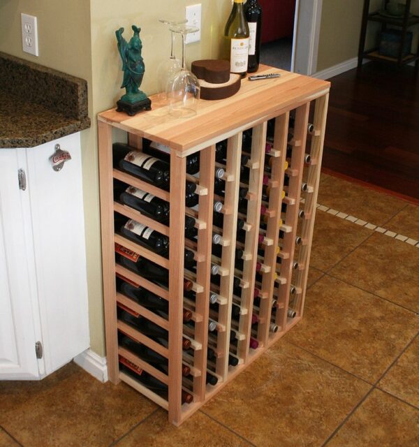 A wine rack is shown in the middle of a kitchen.