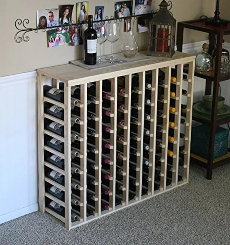 A wine rack with many bottles of wine on it.