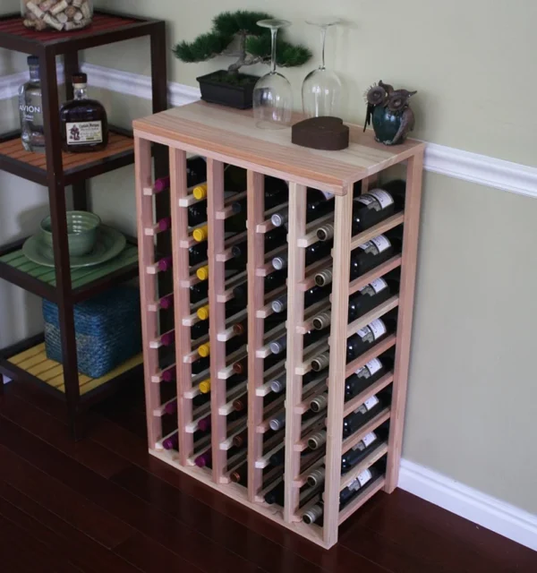 A wine rack with many bottles of wine on it.