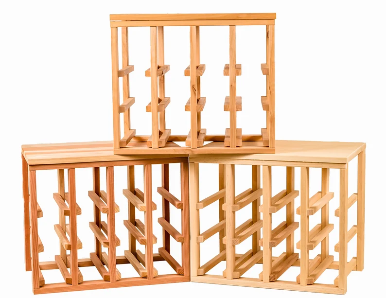 A stack of wooden wine racks with no one in it.